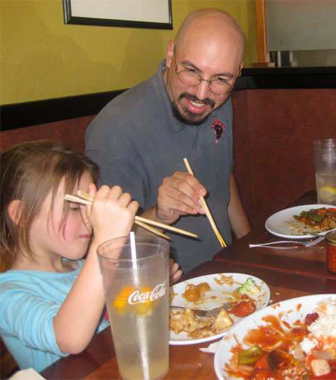 Brandon teaches the chop sticks.